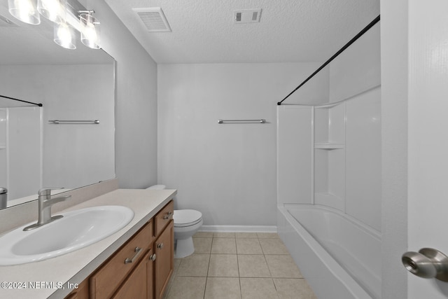 full bathroom featuring vanity, tile patterned flooring, toilet, a textured ceiling, and tub / shower combination