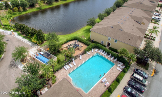 view of pool with a water view