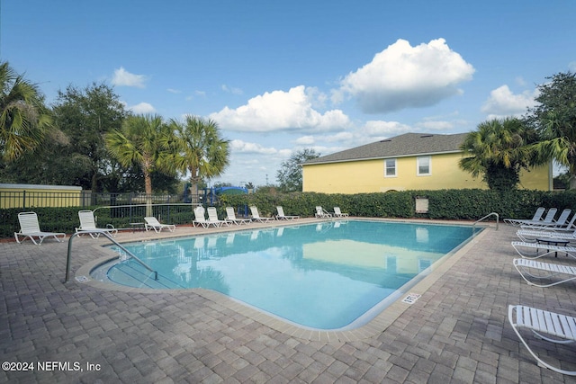 view of pool featuring a patio area