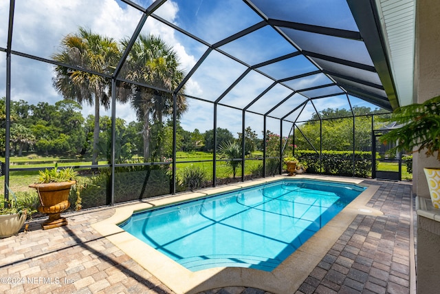 view of pool featuring a patio and a lanai