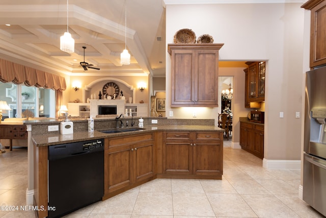 kitchen with dishwasher, dark stone counters, coffered ceiling, sink, and stainless steel refrigerator with ice dispenser