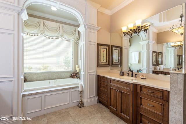 bathroom featuring a washtub, tile patterned flooring, decorative columns, crown molding, and vanity