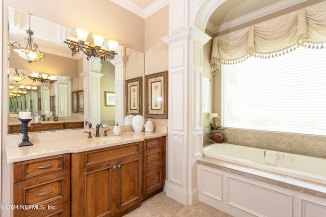 bathroom featuring tile patterned flooring, a bathtub, vanity, and decorative columns