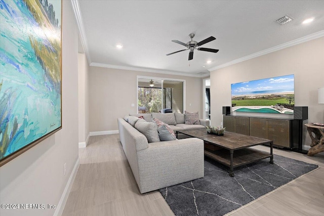 living room featuring ceiling fan, light wood-type flooring, and ornamental molding