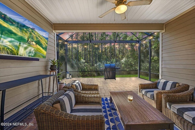 sunroom / solarium with ceiling fan and wood ceiling