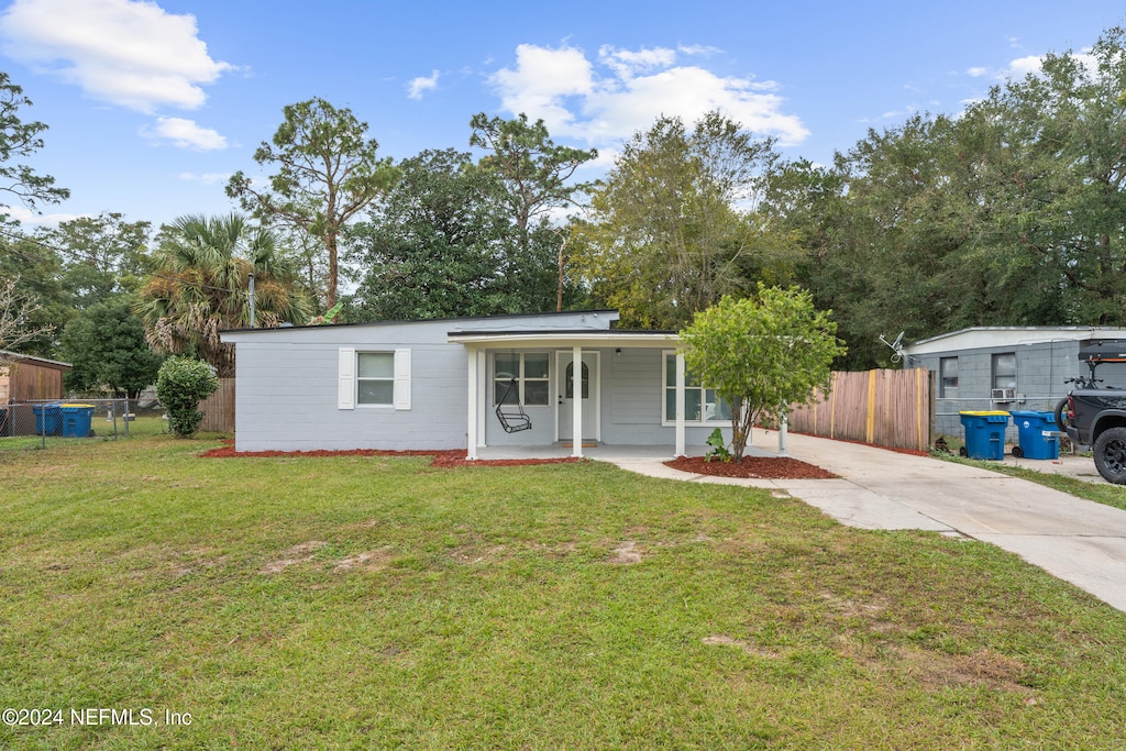 10518 Ashby Rd, Jacksonville, FL 32218 - view of front of house with a porch and a front yard