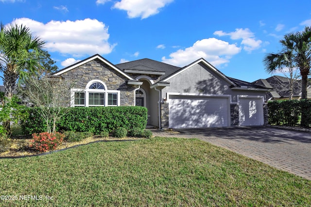 view of front of house with a garage and a front yard