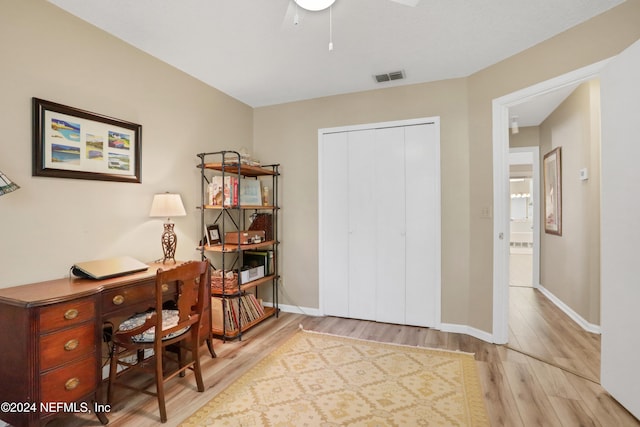 office with light wood-type flooring