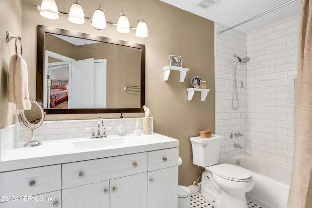 full bathroom featuring tile patterned floors, vanity, shower / tub combo, and toilet