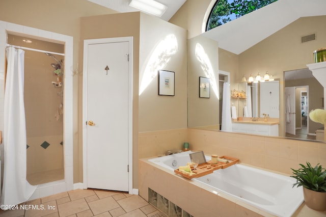 bathroom with separate shower and tub, tile patterned flooring, vanity, and vaulted ceiling