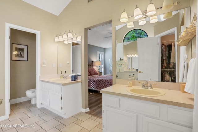 bathroom featuring hardwood / wood-style floors, vanity, ceiling fan, and toilet