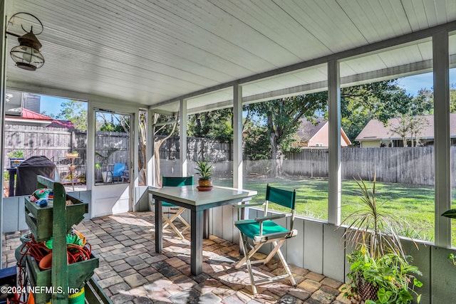 unfurnished sunroom featuring plenty of natural light