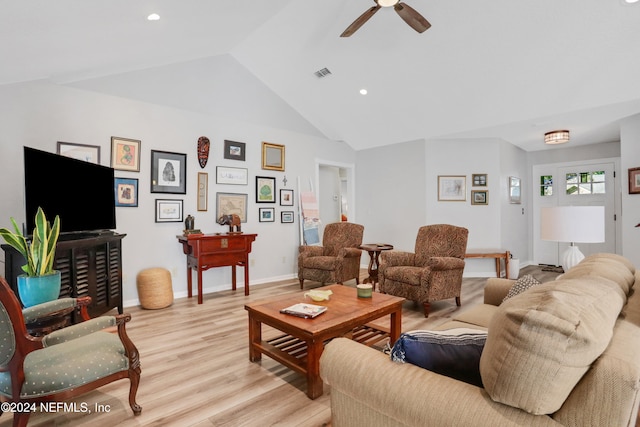 living room with light wood-type flooring, ceiling fan, and lofted ceiling