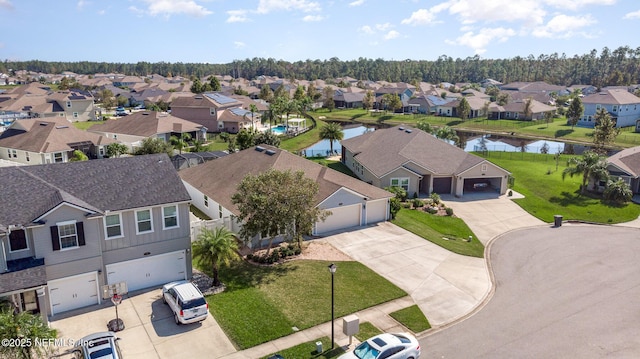 aerial view featuring a residential view and a water view