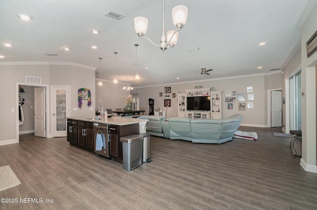 kitchen with a notable chandelier, a sink, visible vents, and stainless steel dishwasher