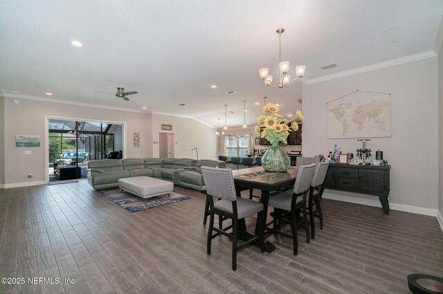 dining room featuring visible vents, ornamental molding, and wood finished floors