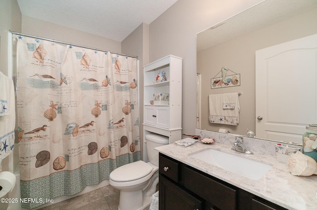 full bathroom with tile patterned floors, toilet, a textured ceiling, a shower with shower curtain, and vanity