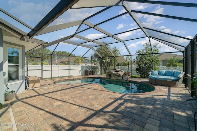 view of pool featuring fence, a patio area, a fenced in pool, and a hot tub