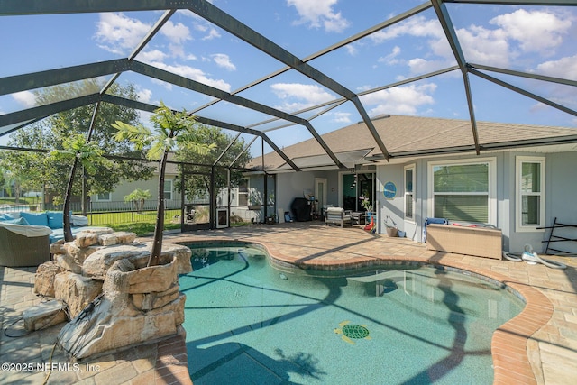 pool with a patio and fence