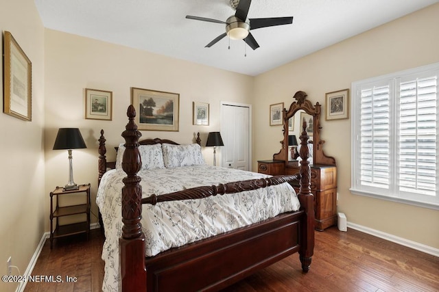 bedroom featuring ceiling fan, dark hardwood / wood-style floors, and a closet