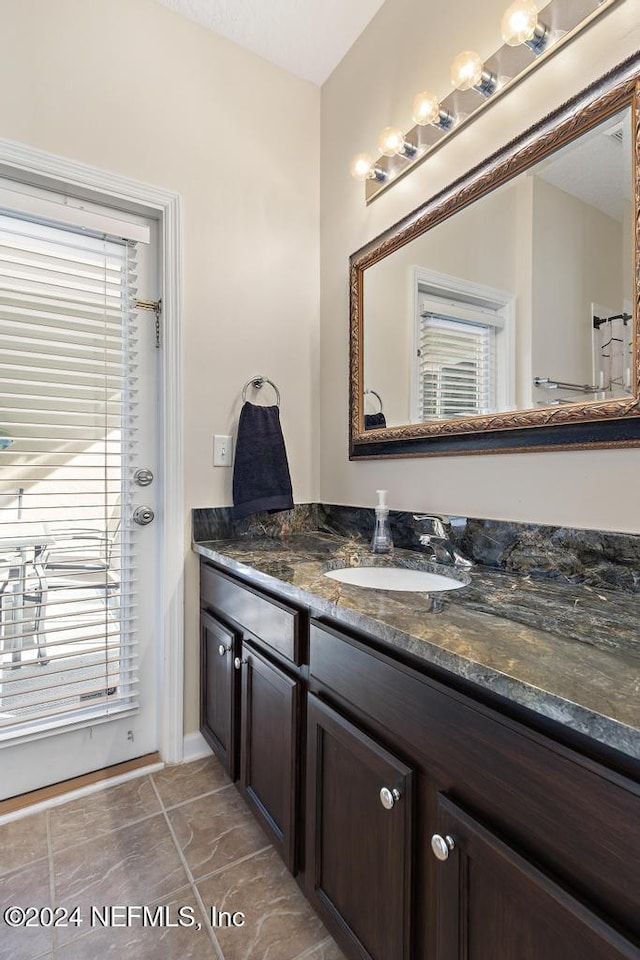 bathroom featuring tile patterned floors and vanity