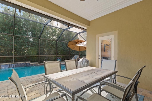 exterior space featuring pool water feature, a lanai, and a patio