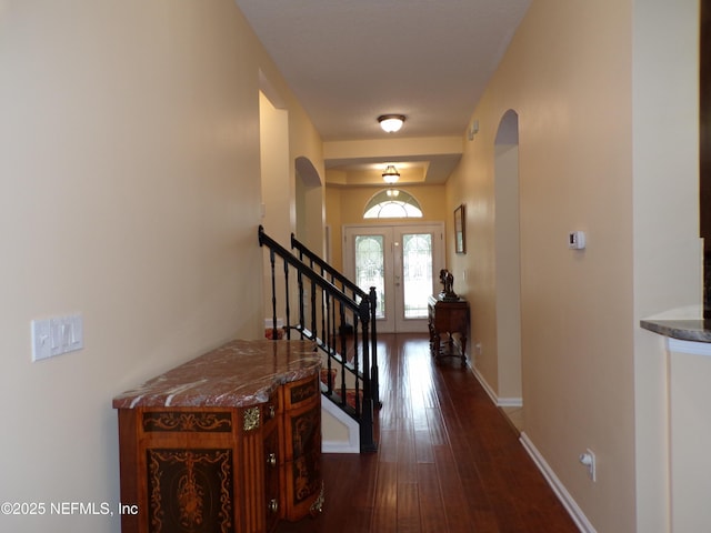 entryway featuring french doors and dark wood-type flooring