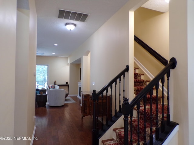 hall with hardwood / wood-style flooring