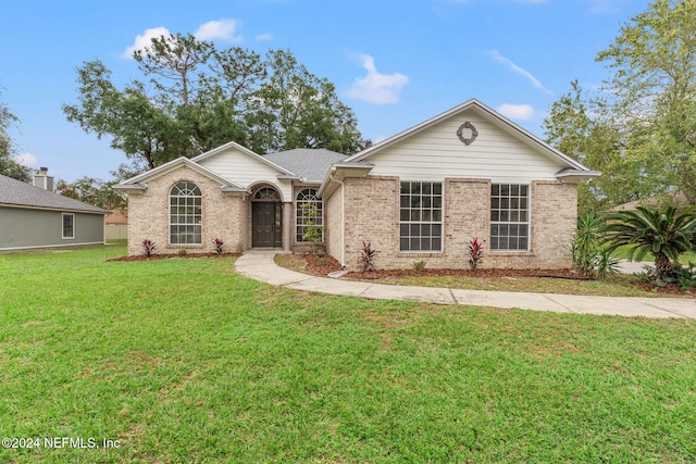 ranch-style home with a front yard