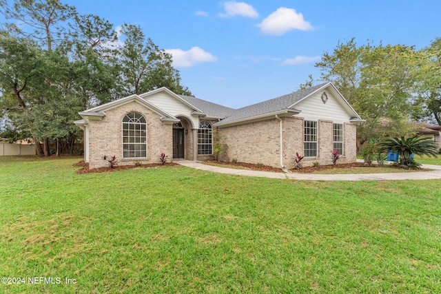 ranch-style house with a front lawn