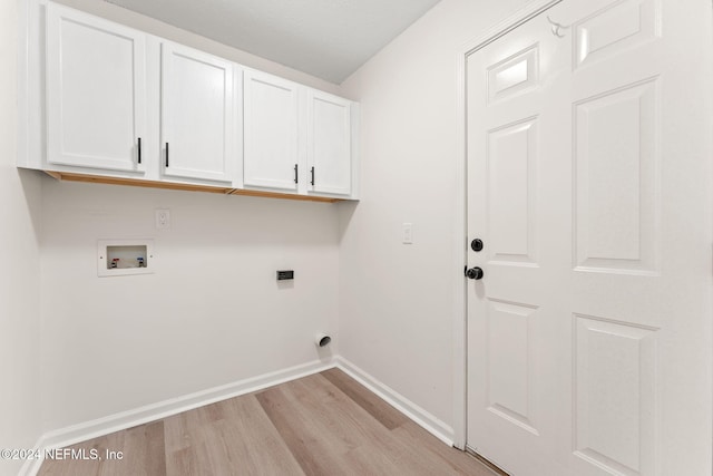 laundry area featuring cabinets, hookup for a washing machine, light wood-type flooring, and electric dryer hookup