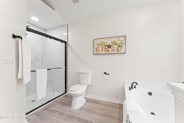 bathroom with hardwood / wood-style flooring, toilet, and independent shower and bath