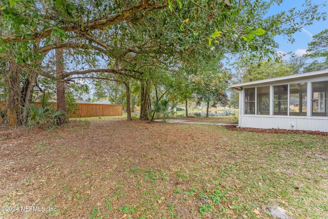 view of yard featuring a sunroom