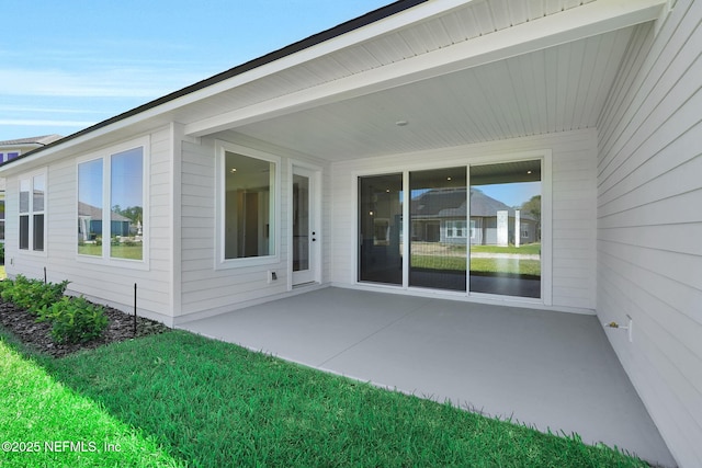 back of property with a patio