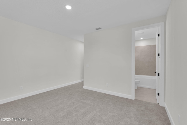 unfurnished room with carpet, recessed lighting, and baseboards