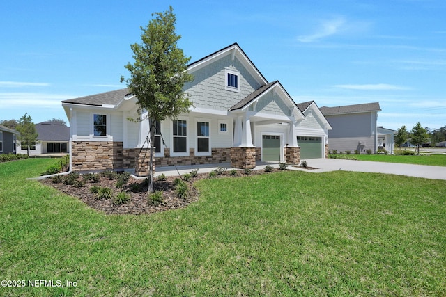craftsman-style home featuring stone siding, concrete driveway, a garage, and a front lawn