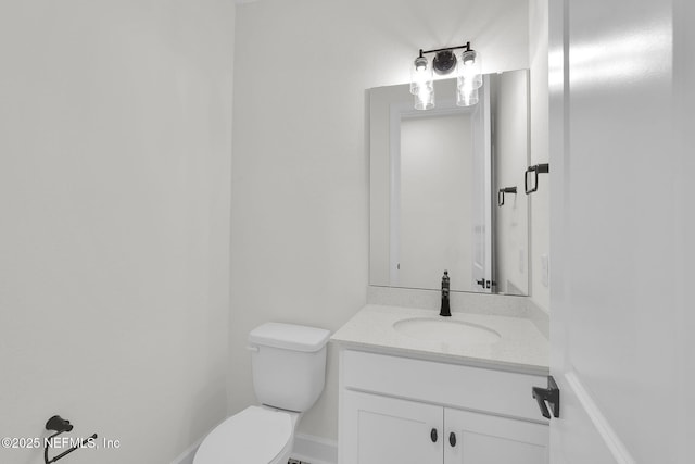 bathroom with toilet and vanity