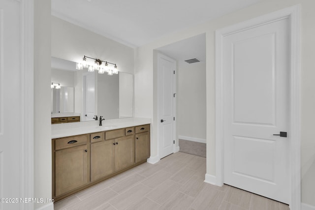 bathroom featuring vanity and baseboards