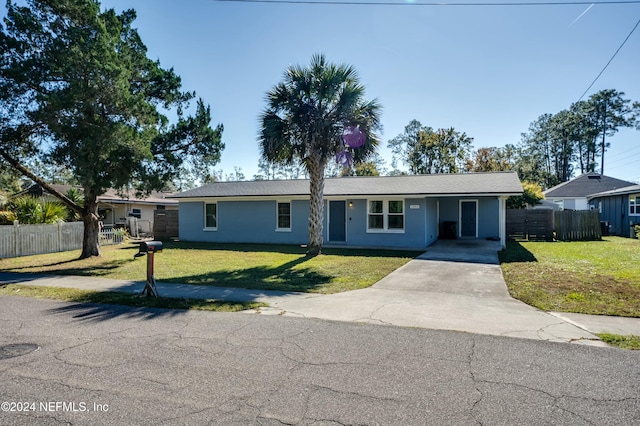 ranch-style house with a front yard