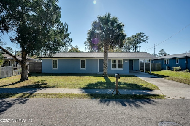 ranch-style house with a front lawn