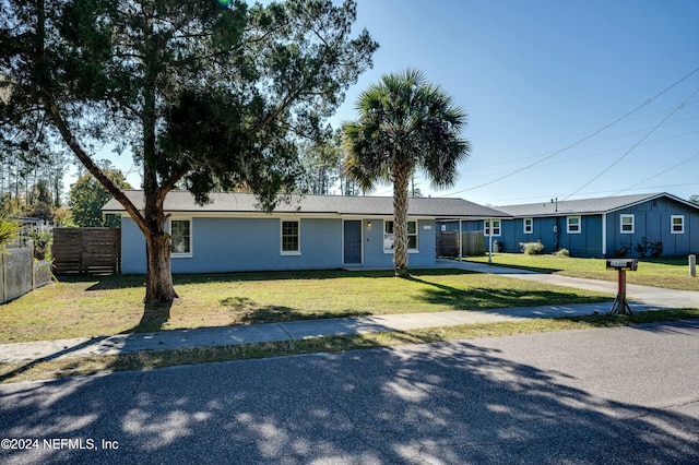 ranch-style house with a front yard