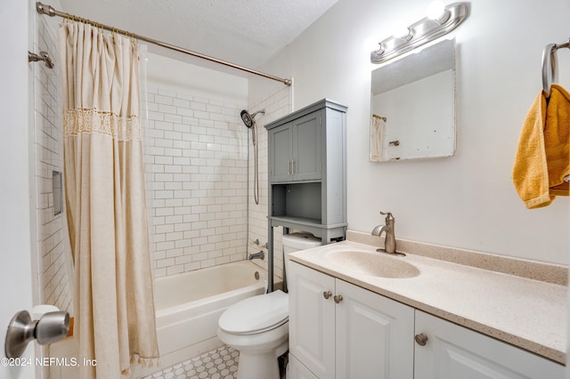 full bathroom featuring tile patterned floors, shower / bath combination with curtain, a textured ceiling, toilet, and vanity