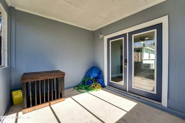 view of exterior entry featuring a patio area