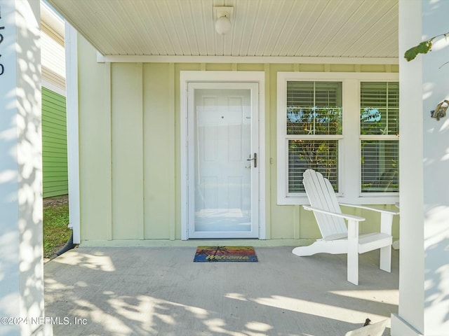 156 Sandy Beach Ln, Atlantic Beach, FL 32233 - property entrance featuring board and batten siding and covered porch