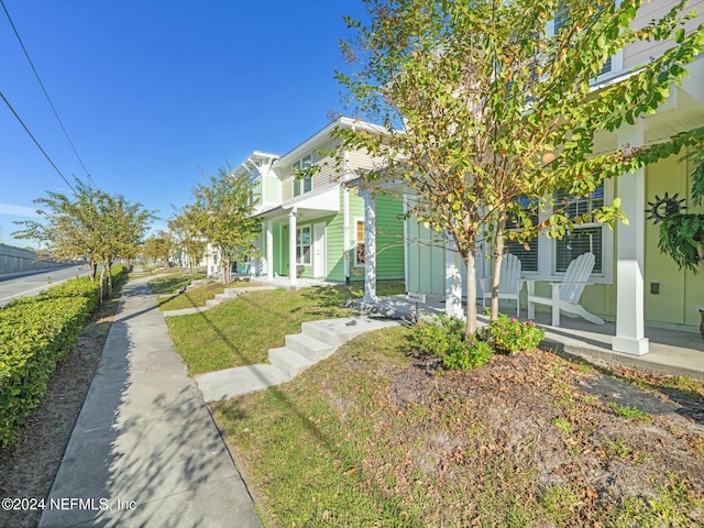 156 Sandy Beach Ln, Atlantic Beach, FL 32233 - view of grassy yard with a porch