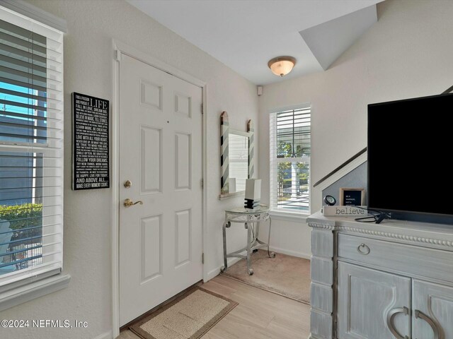 156 Sandy Beach Ln, Atlantic Beach, FL 32233 - foyer entrance with light wood finished floors and baseboards