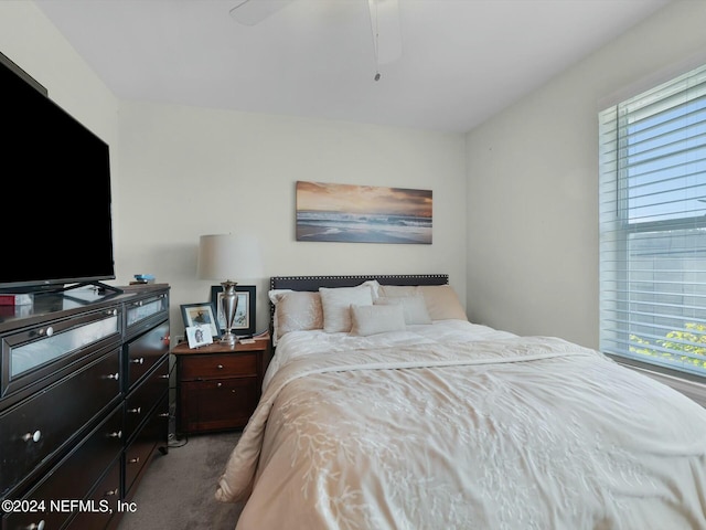 carpeted bedroom featuring ceiling fan