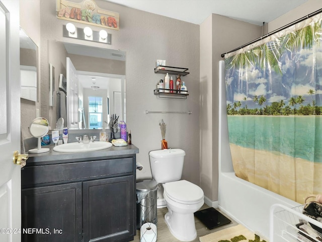 full bathroom with toilet, shower / tub combo with curtain, and vanity