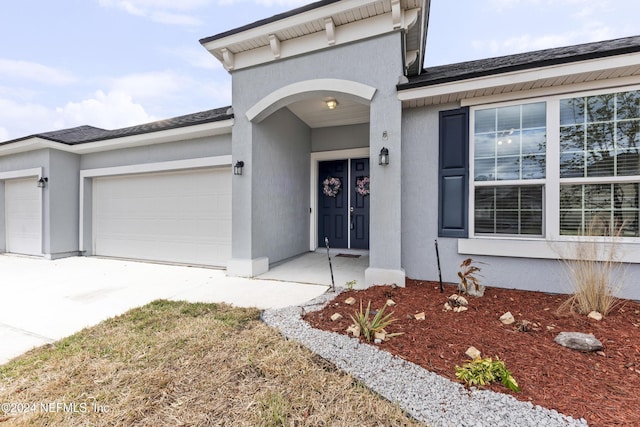 property entrance with a garage