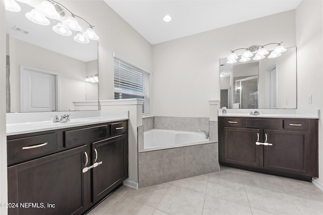 bathroom featuring vanity, tile patterned floors, and separate shower and tub